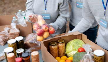 Volunteers Collecting Food Donations Close Up